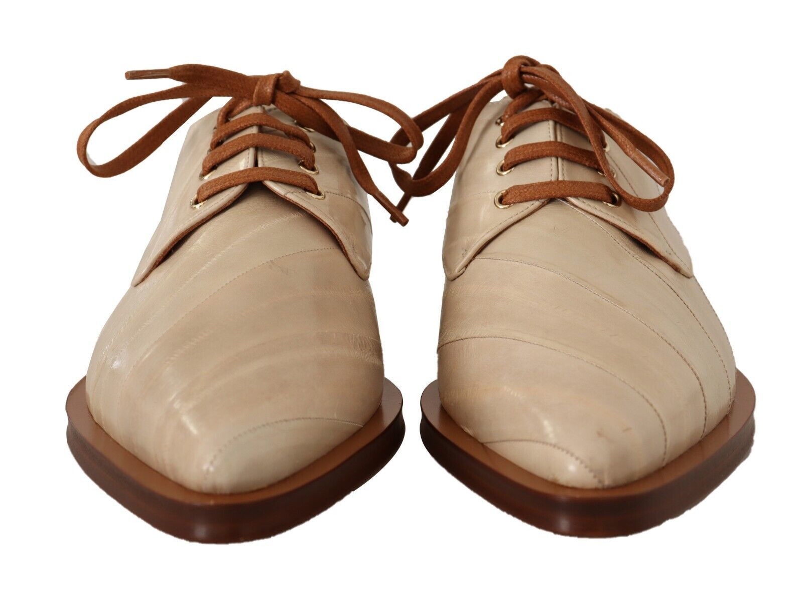 a pair of white shoes with brown laces