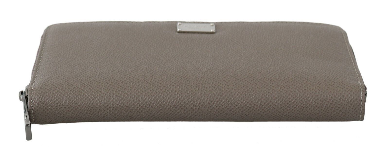 a gray purse with a metal handle on a white background