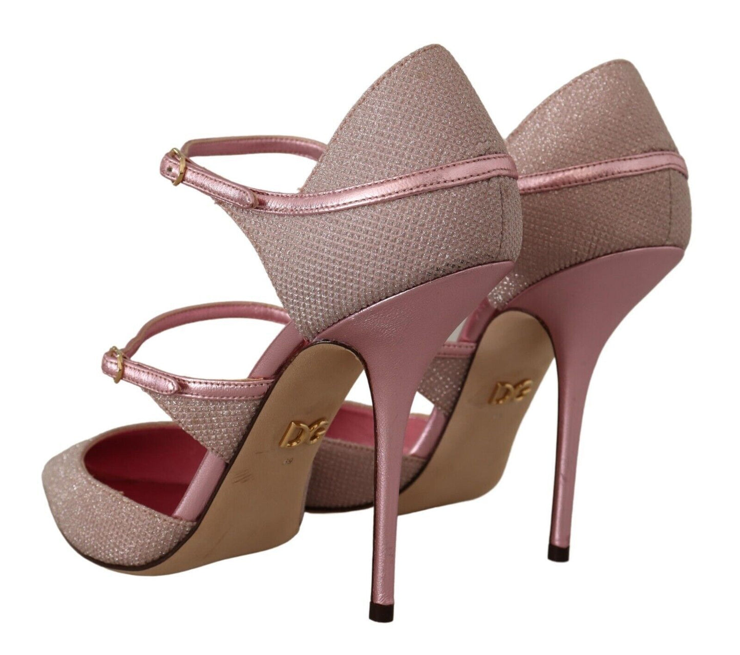 a pair of pink high heeled shoes on a white background